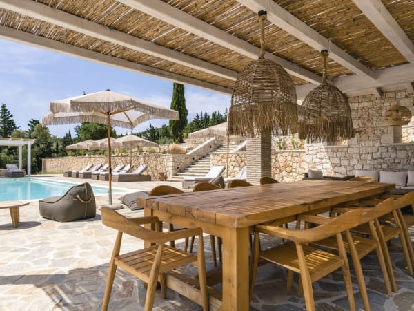 The shady dining terrace by the pool.